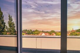 Aussicht auf den Sonnenuntergang aus dem Penthouse Apartement in der Flakowski Residenz